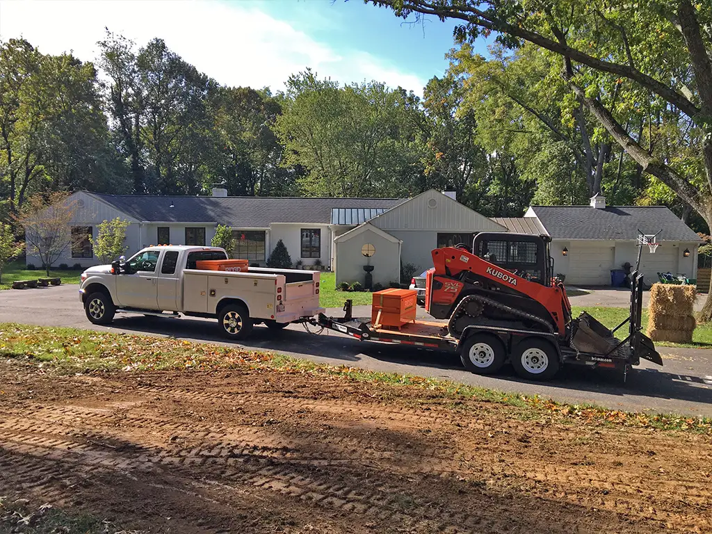 Company Truck and Skid Loader of Remove A Pool