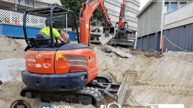 Heavy machinery moving sand across the demolished pool site, leveling the area for further landscaping.
