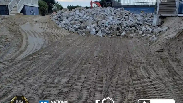 A close-up of dark soil ready for landscaping at the site where a pool has been removed.
