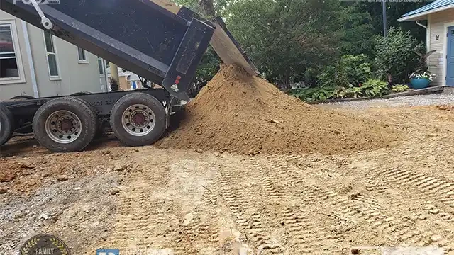 Step 14: We are now unloading another truckload of soil for leveling. Another truckload of soil was unloaded for leveling.