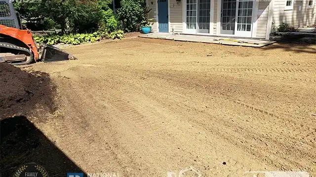 Step 17: Our skid loader double-checked the area to ensure everything is leveled, compacted, and ready for landscaping. The skid loader double-checked grading and compaction for landscaping.
