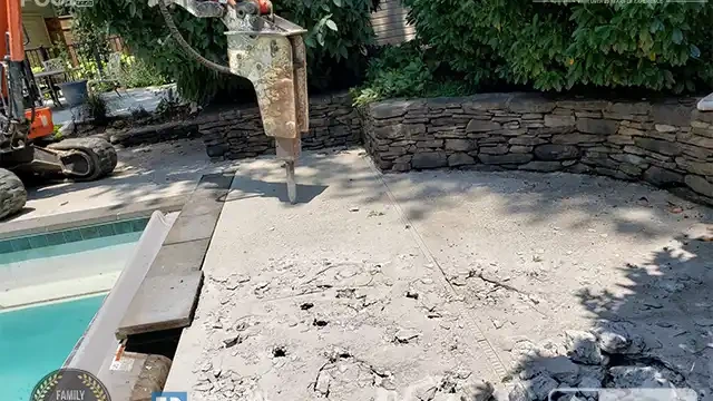 Step 2: The client chose Full Removal for this project. We successfully obtained all the necessary permits and began draining the pool. Our excavator also started breaking through the pool deck. The client chose Full Removal. Permits were obtained, and we began draining the pool while breaking the deck.
