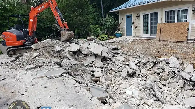 Step 7: We are now removing some of the concrete blocks that were demolished from the pool and the deck. We removed concrete blocks from the demolished pool and deck.
