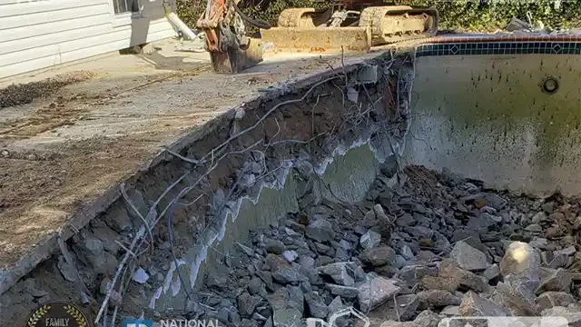 Step 12: We move on to breaking sections of the pool deck, making room for the next stage of the removal. We broke some parts of the deck.