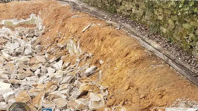 Step 16: The opposite side of the pool deck is demolished, and we fill the area with dirt to ensure consistency. We break the other side of the pool deck and fill it in.