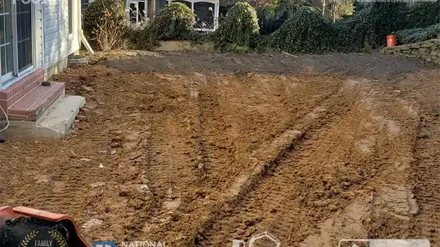 Step 26: Final stages of leveling and compacting are almost complete, ensuring the area is ready for landscaping. Leveling and compacting were nearly finished.