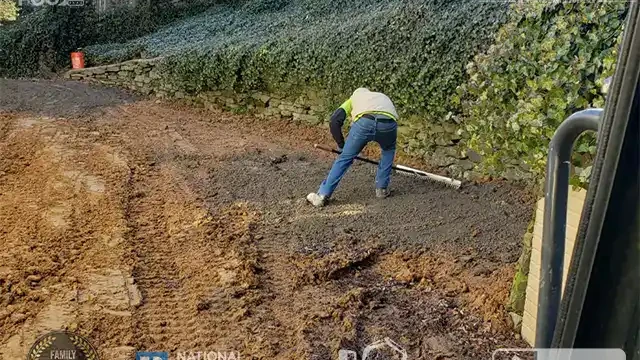 Step 27: Our team begins layering the soil in preparation for grass seeding, ensuring everything is ready for the next step. One of our team member began layering soil for grass.