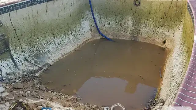 Step 8: We quickly drained the rainwater from the pool so that we could get back to work and continue with the demolition. We drained the rainwater and continued the process.