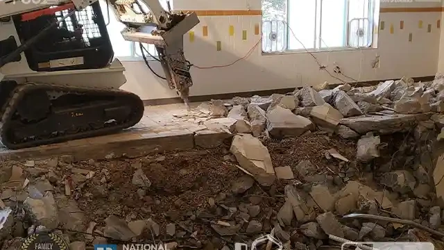 Remove A Pool skid loader. Start removing the pool deck near the window