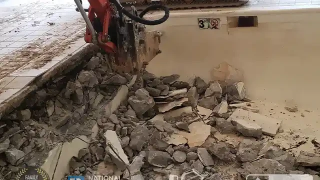 Remove A Pool excavator tearing the wall of the pool